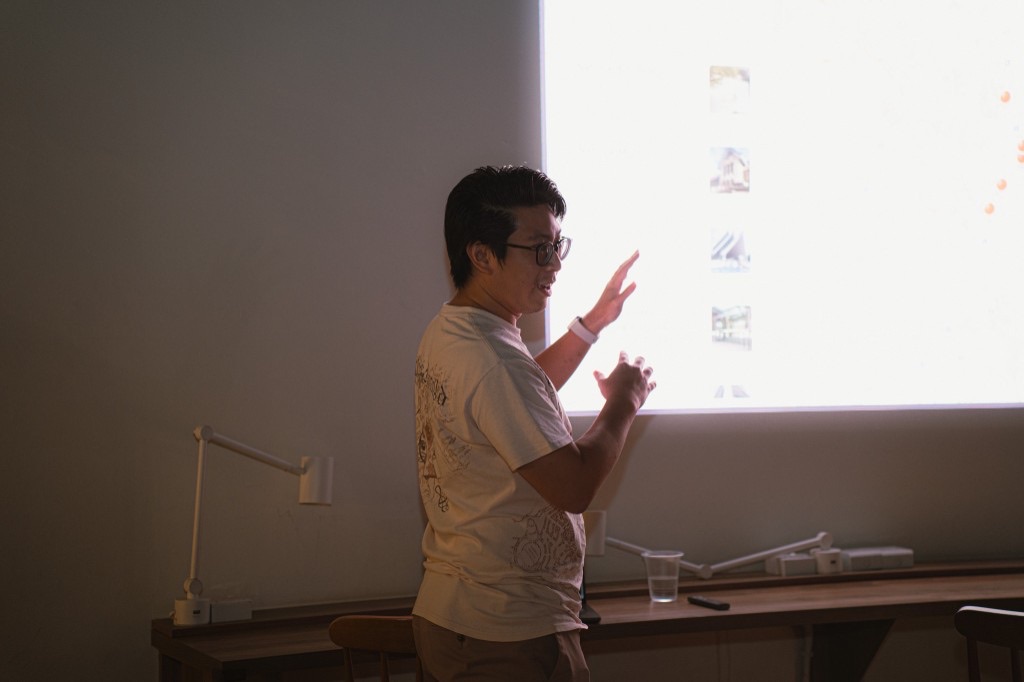 Presenter gesturing at a projected interface
