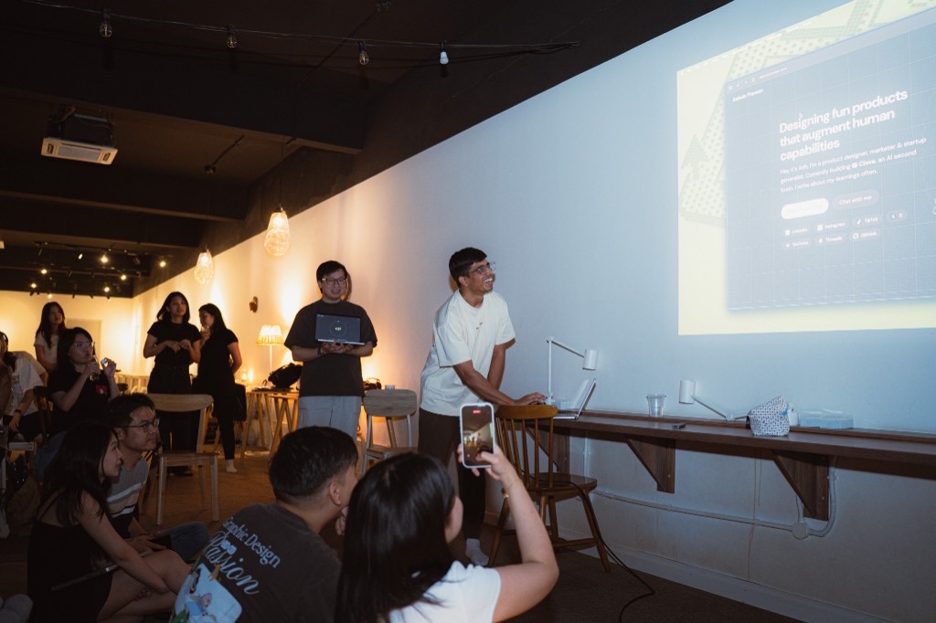Ash presenting a portfolio on the wall