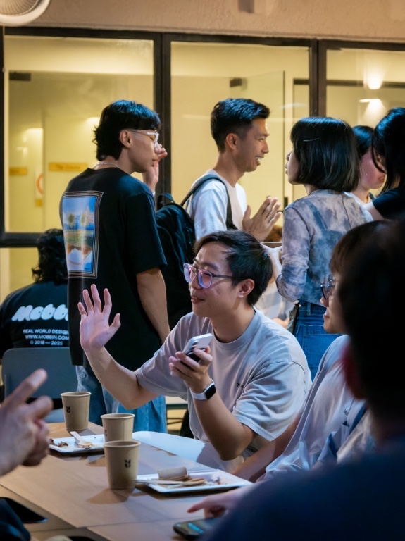 Talking over paper cups at the table